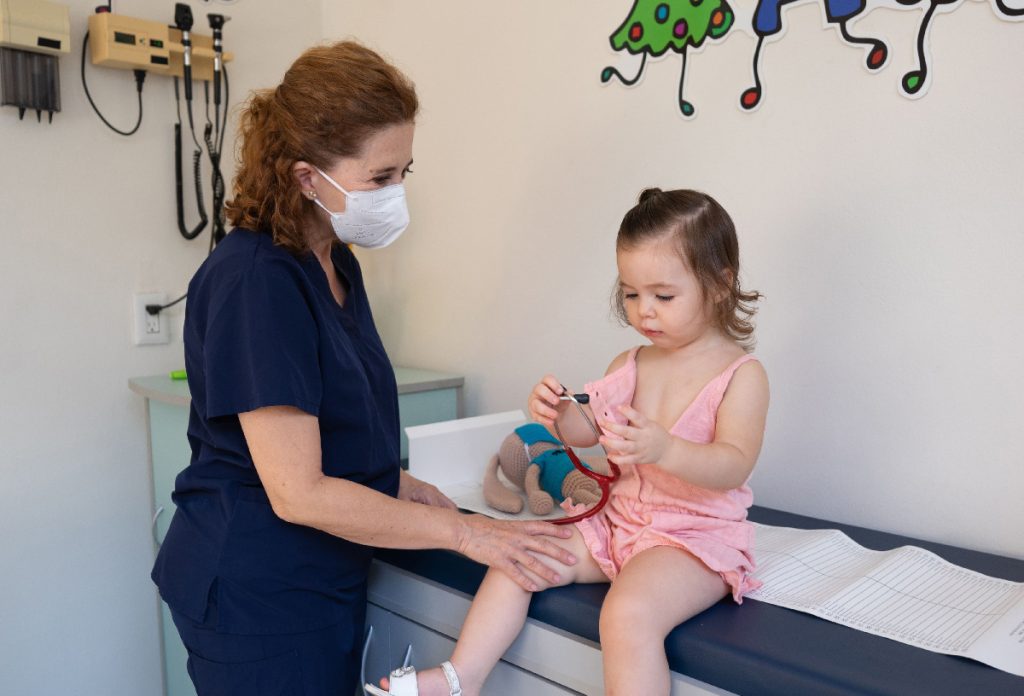 doctor helping child with autism